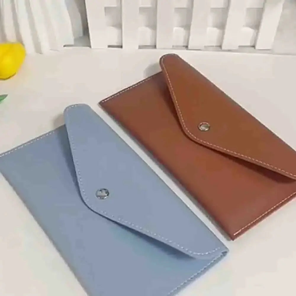 Two unisex retro long wallets in blue and brown with snap closures