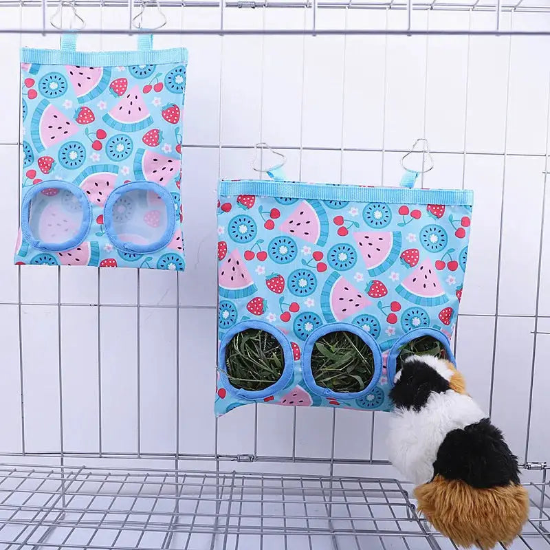 2 rabbit hay bags; blue patterned hanging feeders with 2–3 holes for small animals, guinea pig nibbling