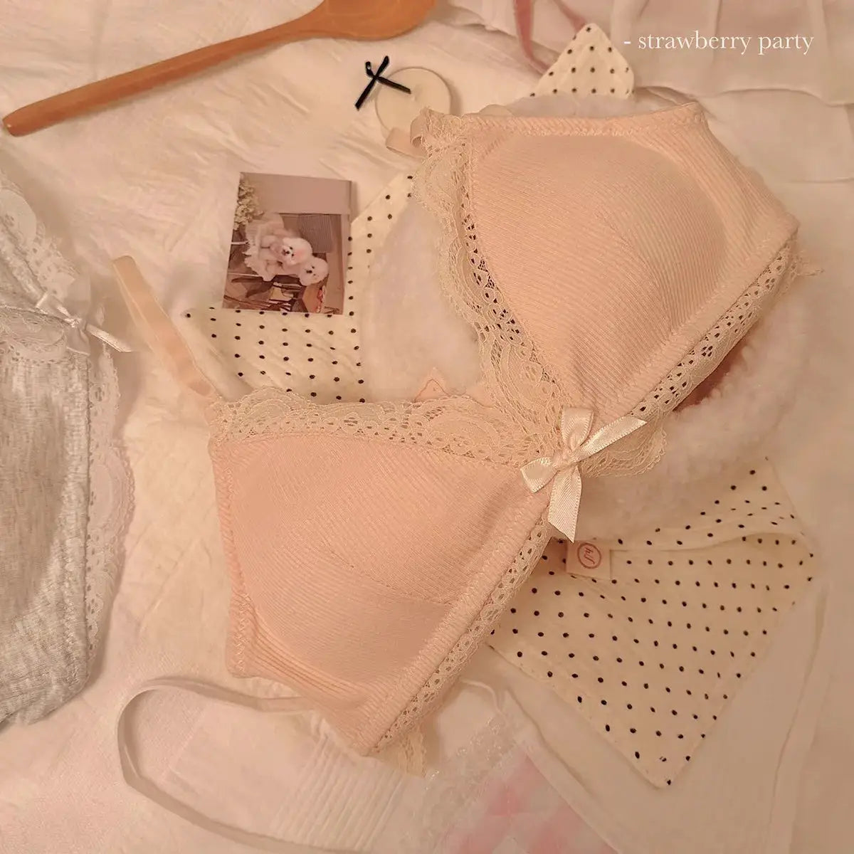 Women's pink lace triangle-cup wireless bra with bow detail