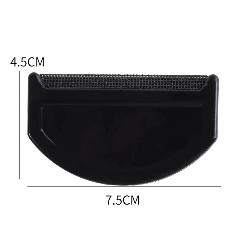 Black lint remover comb for clothes and sweaters, curved shield design, 7.5 cm wide by 4.5 cm tall