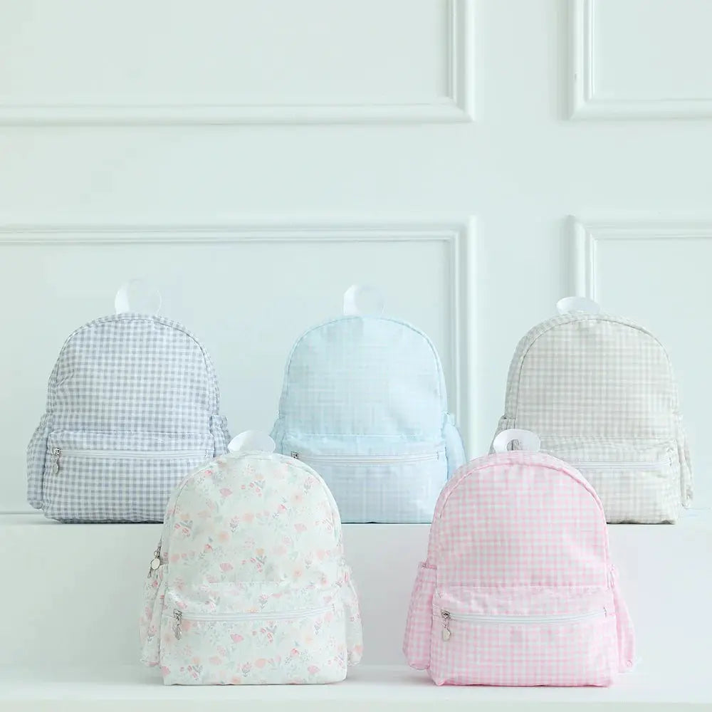Five toddler backpacks in pastel gingham and floral patterns, lightweight durable schoolbags for preschoolers