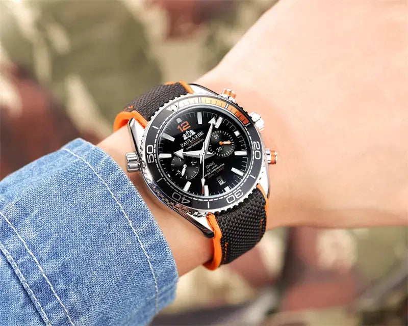 PAULAREIS P luxury men's automatic watch with black dial, silver bezel, and orange-edge rubber strap