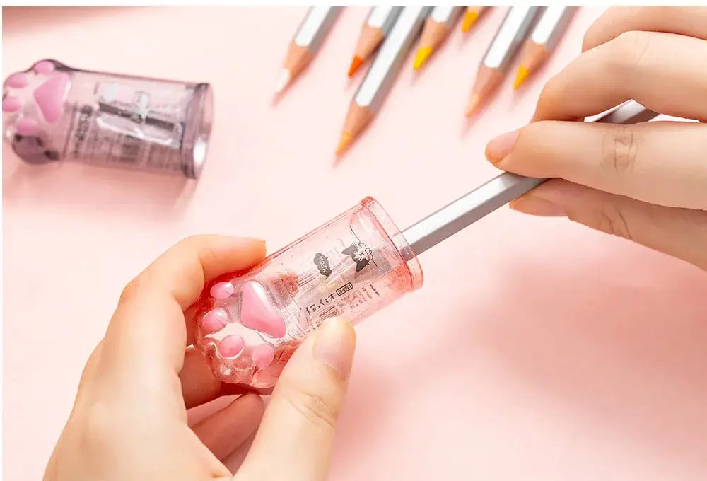 Kawaii cat-paw pencil sharpener, pink translucent plastic by Simples Market Korean stationery