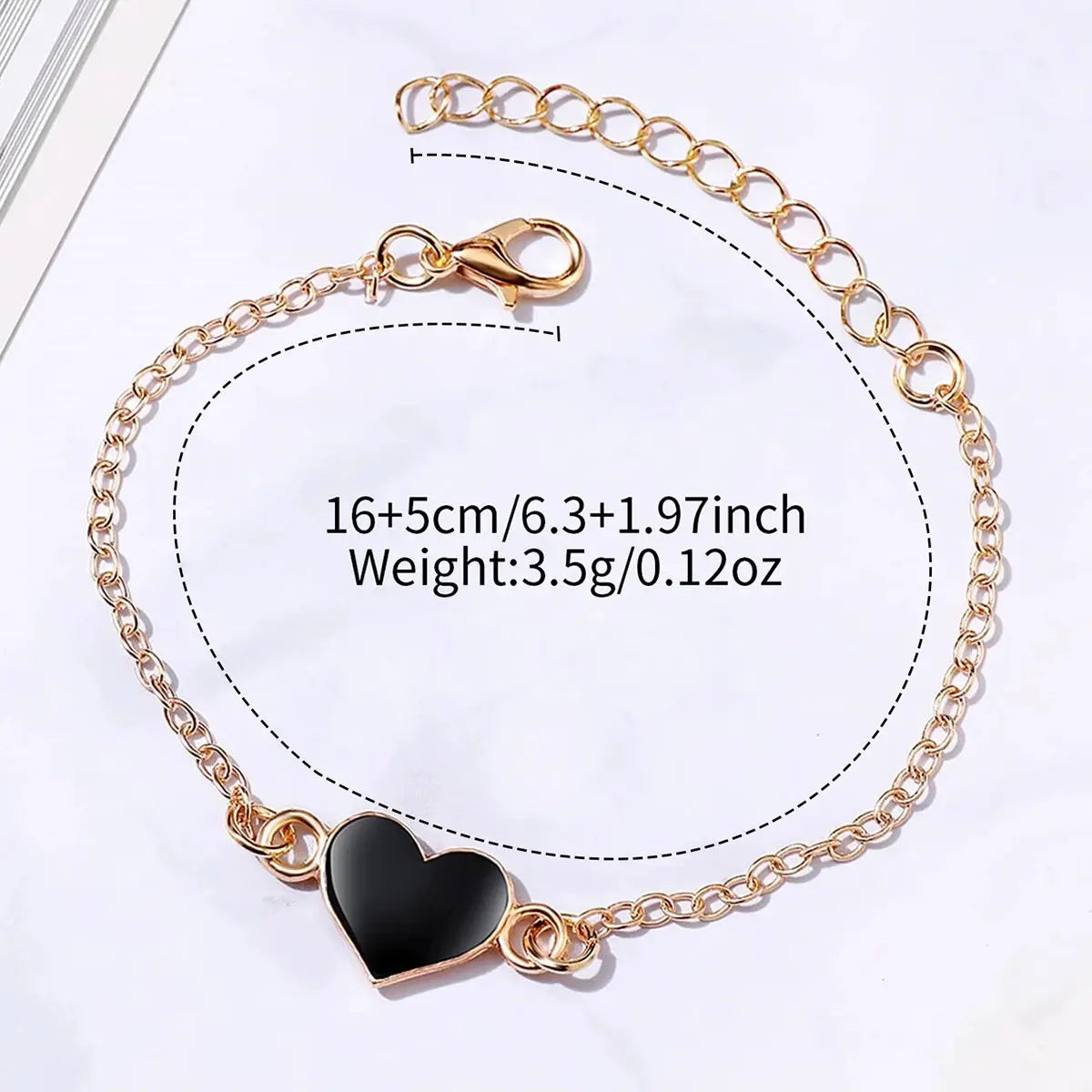 Bracelet with gold-tone chain and black enamel heart pendant; 2pc set by Simples Market