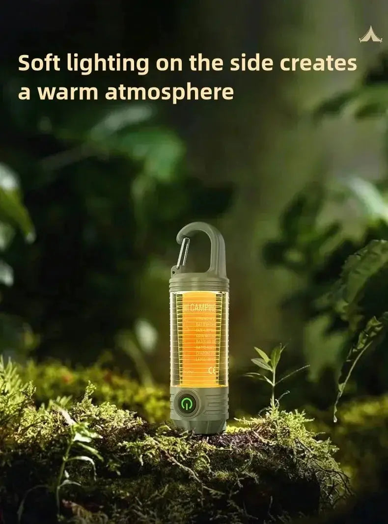 Multi-functional outdoor LED camping light with green housing, amber lantern panel, and hanging hook