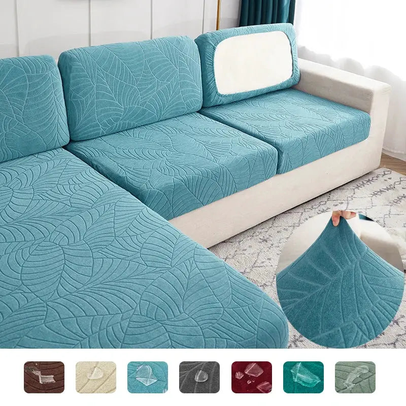 Three teal waterproof stretch seat cushion covers for sofas with leaf-pattern fabric by Simples Market
