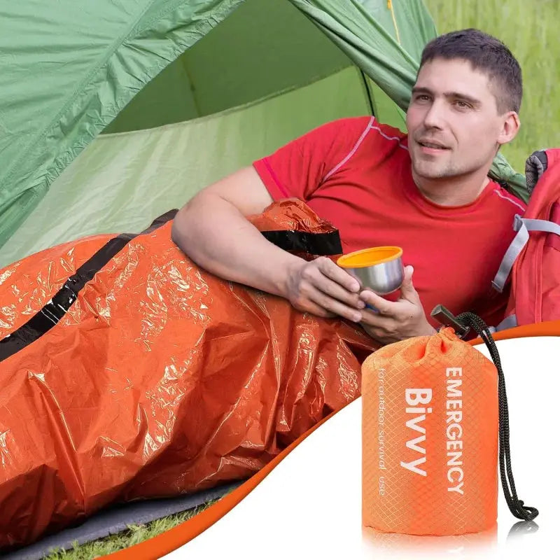 Emergency bivy bag in orange Mylar, lightweight waterproof survival shelter for camping