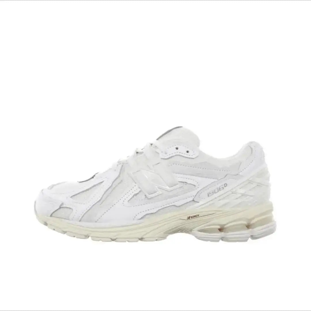 Running shoe, white retro dad-style with chunky sole and 1906 label