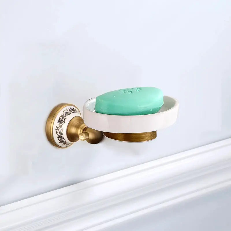 Antique brushed brass wall-mounted soap dish with porcelain dish and green soap, Simples Market