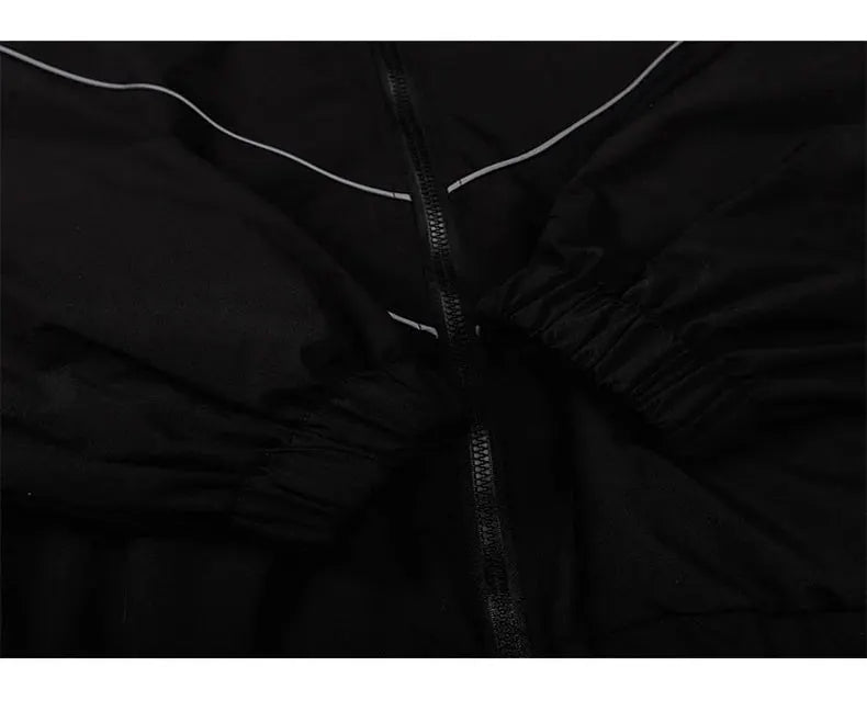 Hip Hop varsity windbreaker jacket in black with white piping, zipper closure and elastic cuffs.