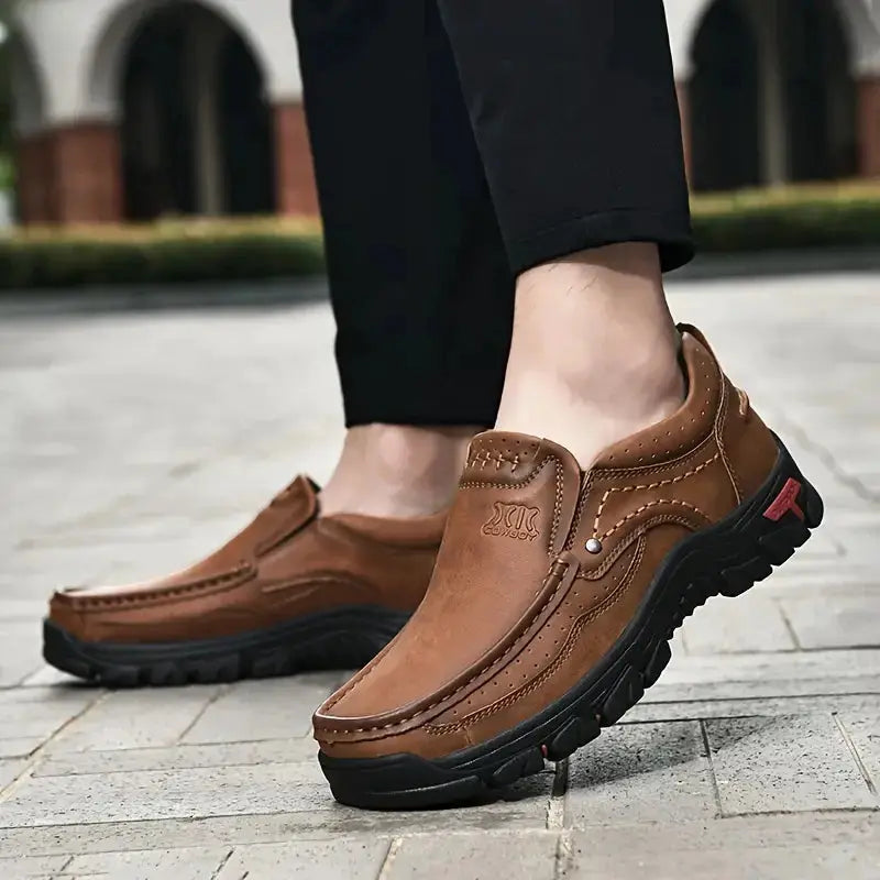 Handmade leather men's slip-on loafers in brown with rugged black outsole by Simples Market