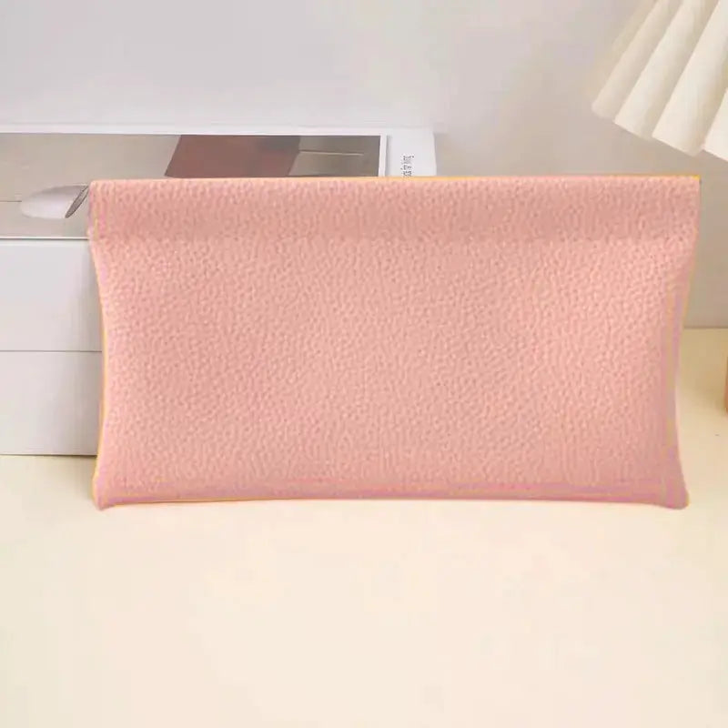 Long pink faux leather wallet with pebble texture and top zipper closure