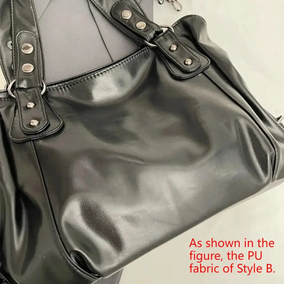 Soft interior compartment shoulder bag by Simples Market in black PU leather with silver studs and double strap hardware