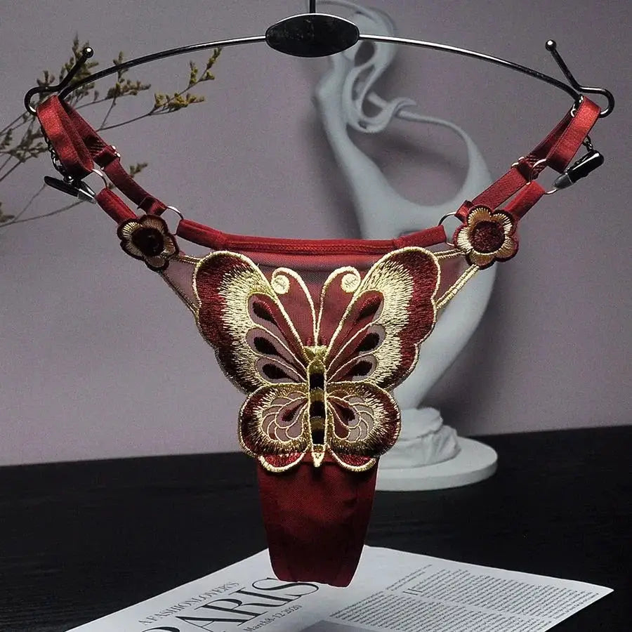 Butterfly lace thong for women, red low-waist G-string with adjustable straps and embroidered gold butterfly on sheer mesh.