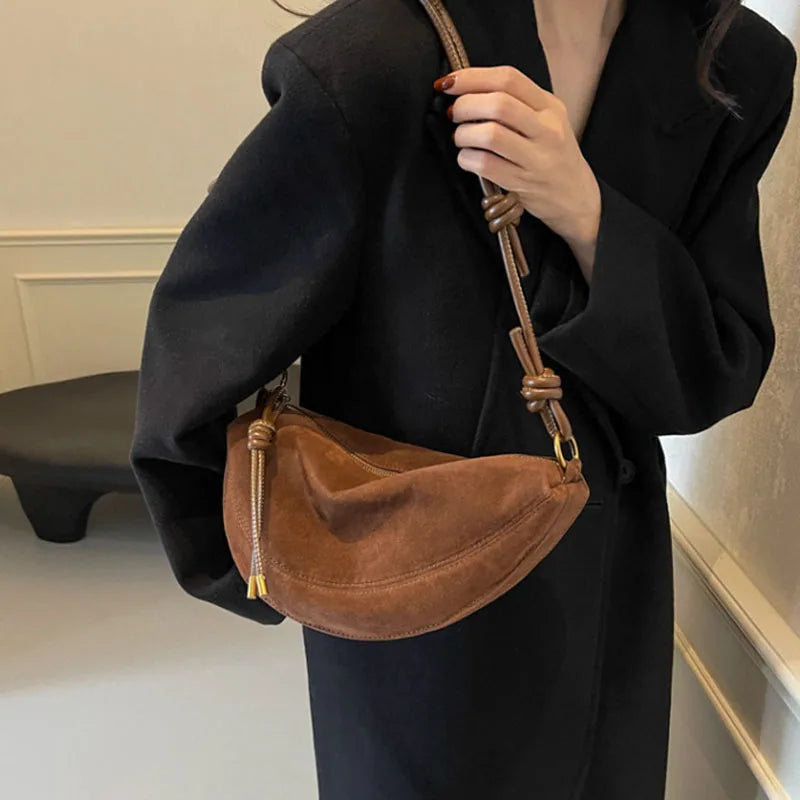 Brown faux suede shoulder bag by Simples Market, dumpling crossbody with knotted strap