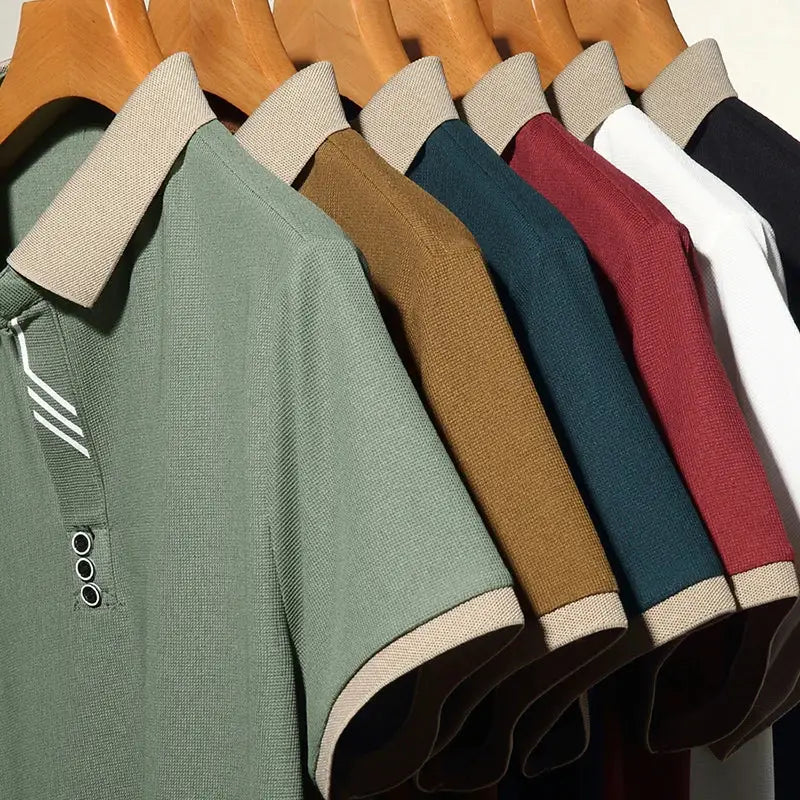 Men's polo shirts on hangers in 8 assorted colors; short sleeves with beige collar trim