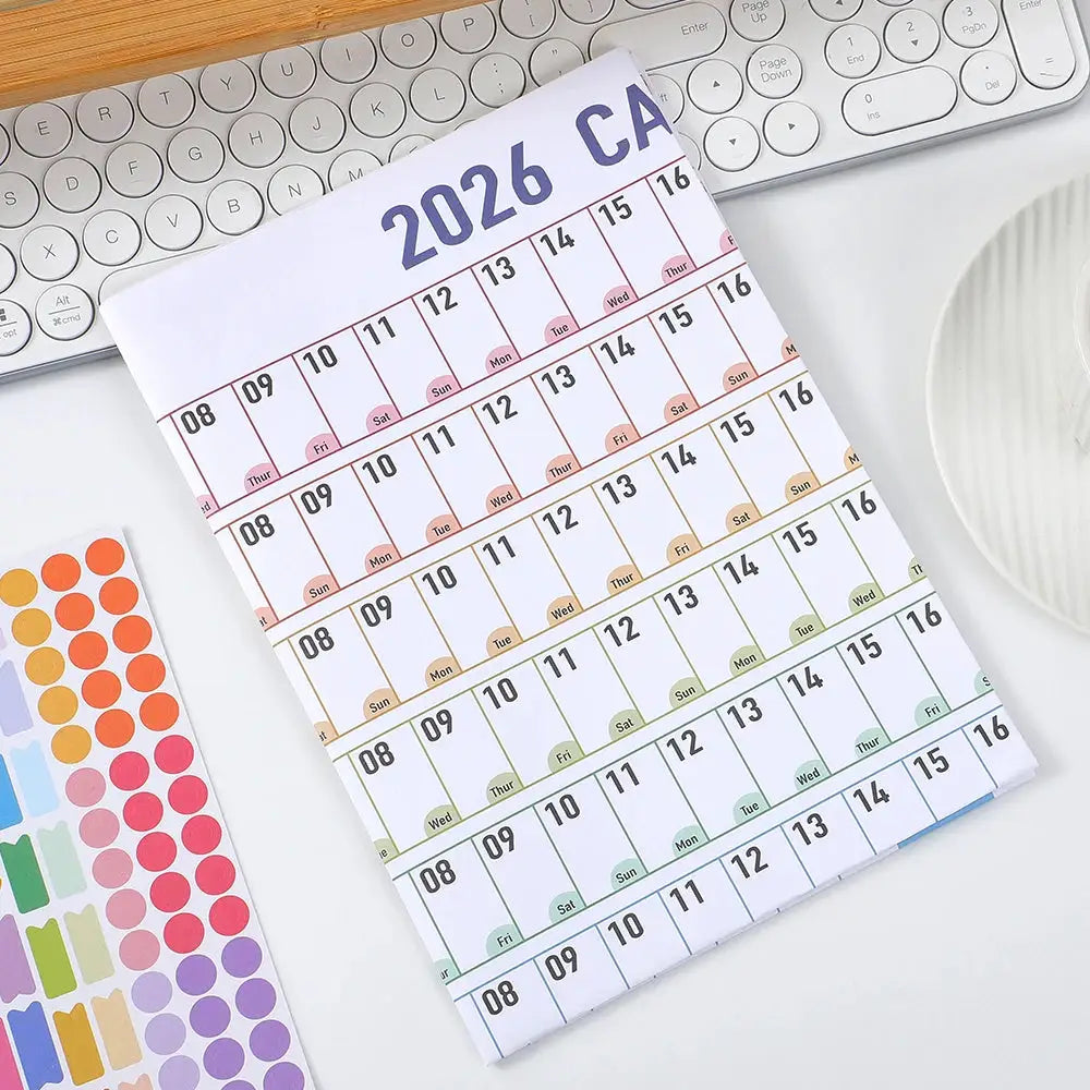 Simples Market 1 Pc 2026 Colorful Paper Wall Calendar with Stickers, pastel grid calendar on desk.
