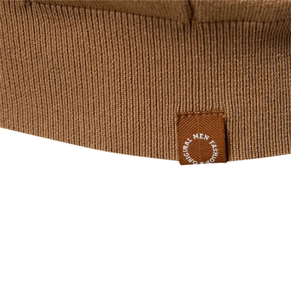 Brown ribbed knit polo fabric close-up with a circular Original Men Fashion patch