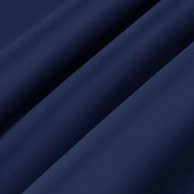 Men's navy solid short-sleeve shirt fabric close-up showing smooth weave