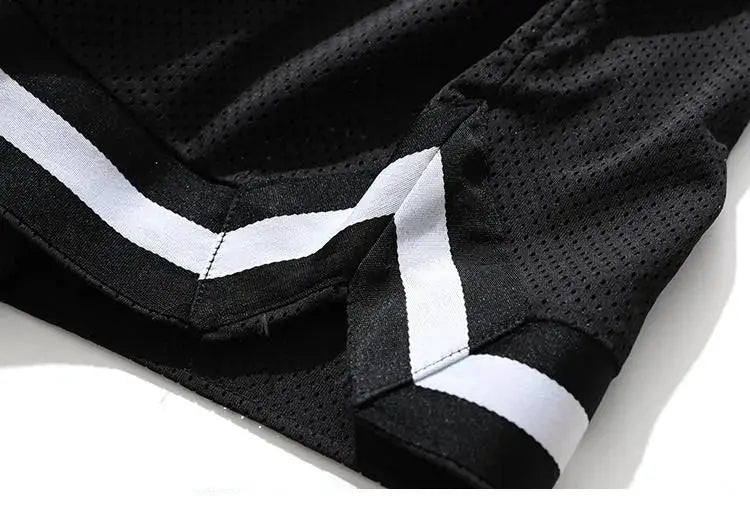 Men's black mesh basketball shorts with white side stripes, quick-dry loose fit.