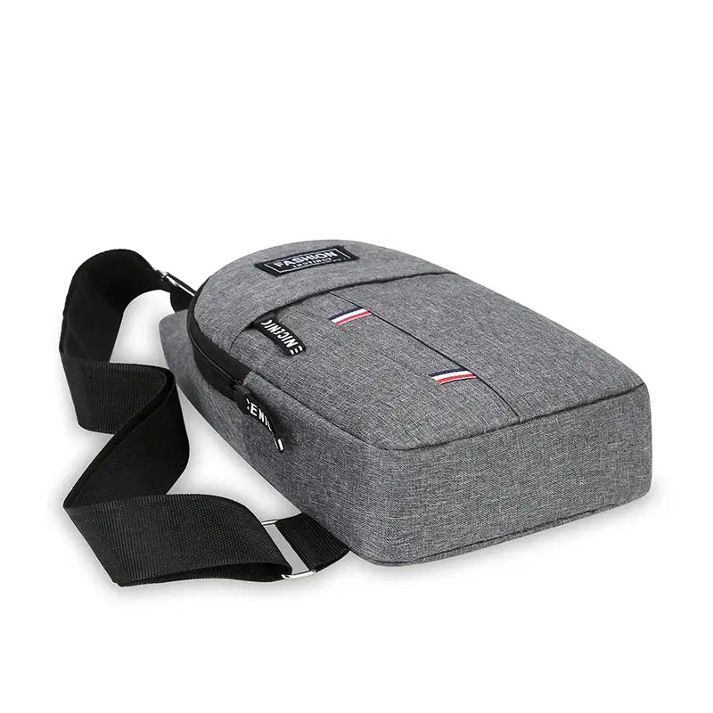 Chest bag, grey fabric crossbody with black adjustable strap and dual zippers