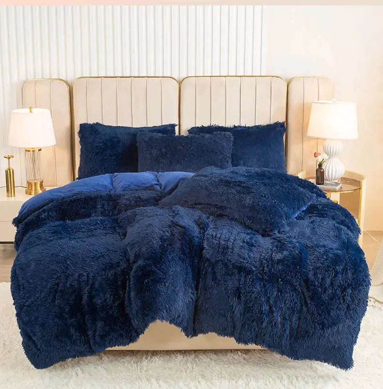 3-Piece Plush Duvet Cover Set in navy with fluffy texture and two matching shams on a beige upholstered bed.