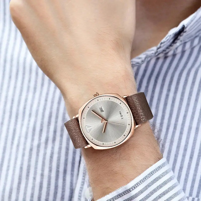 TOMI men's minimalist watch with rose-gold case, silver dial, date window, and brown leather strap