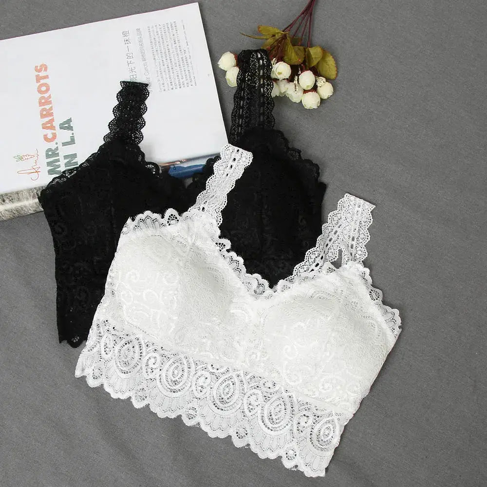 Two lace crop tops in black and white with floral crochet and scalloped hems.