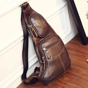 Brown genuine leather crossbody sling bag with multiple zip pockets and adjustable strap