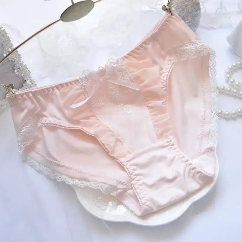 Panties in pink cotton with lace trim, bow detail and floral embroidery, breathable and elastic.