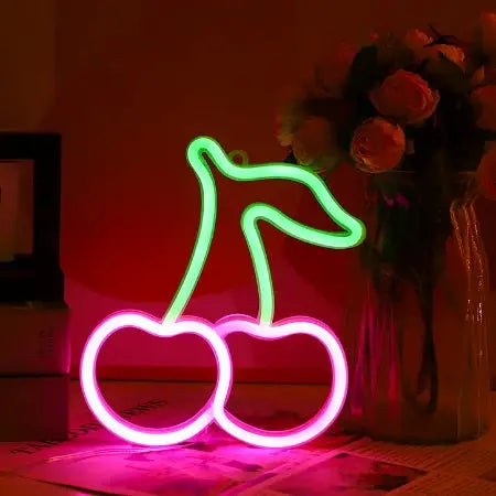 Cherry neon LED sign with two pink cherries and a green stem, decorative light.