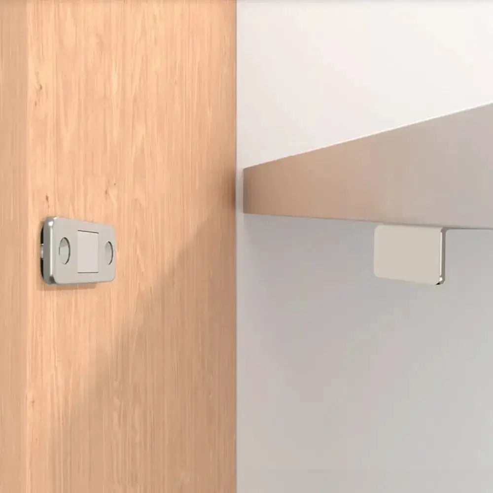 L-Type magnetic door catch set in silver for cabinets and wardrobes, two-piece shown on wood and gray panels