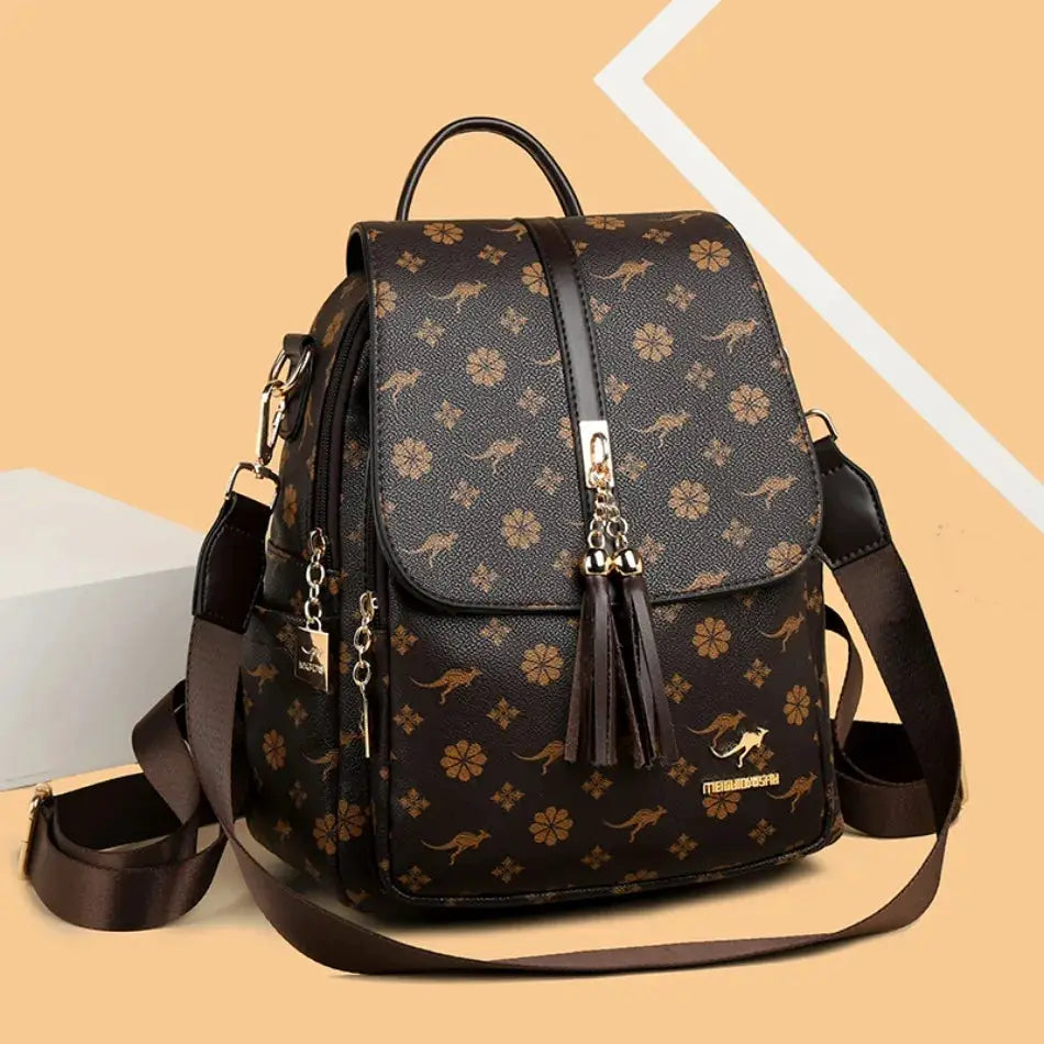 Ladies leather backpack by Simples Market with tassel accents, brown floral print and large capacity