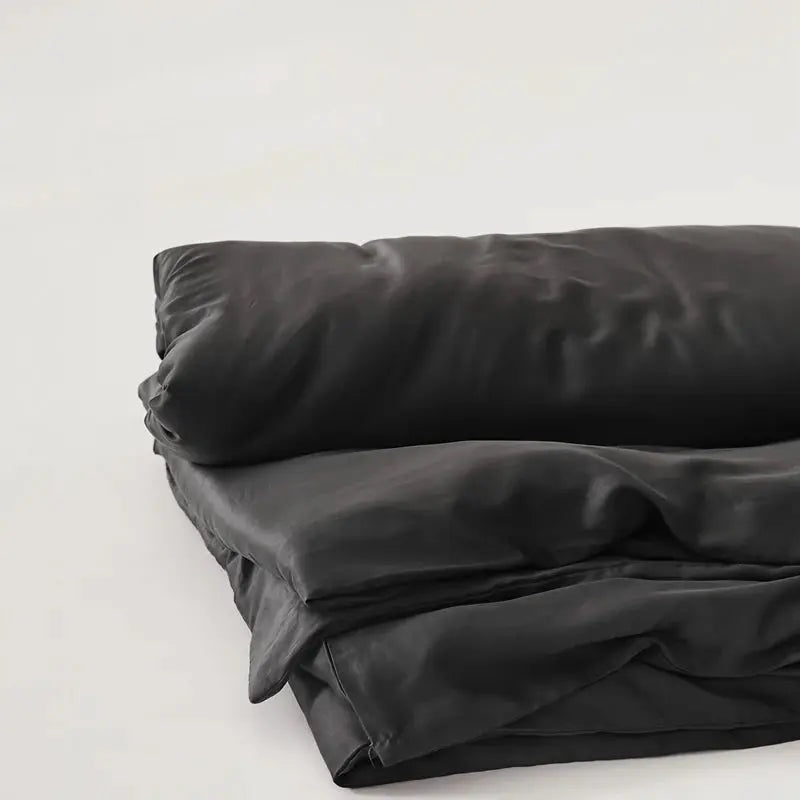Eucalyptus Lyocell duvet cover set by Simples Market in charcoal gray, breathable bedding.