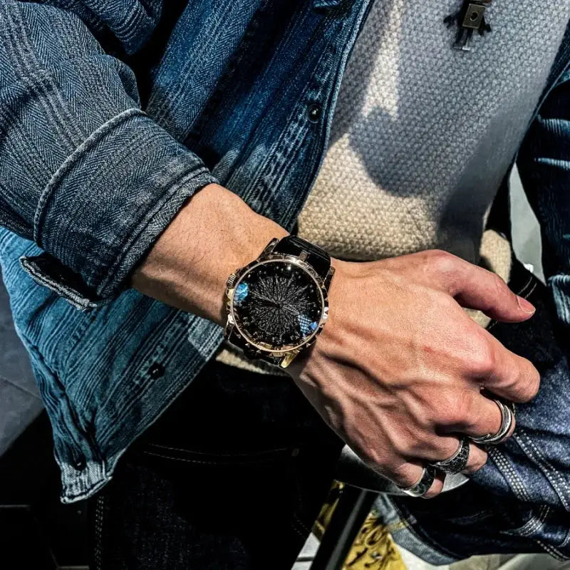 Men's quartz wristwatch with gold-tone case, black dial, and black strap