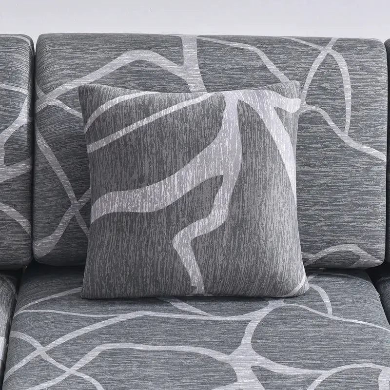 Stretch couch cushion slipcovers in gray with white abstract pattern; includes matching throw pillow.