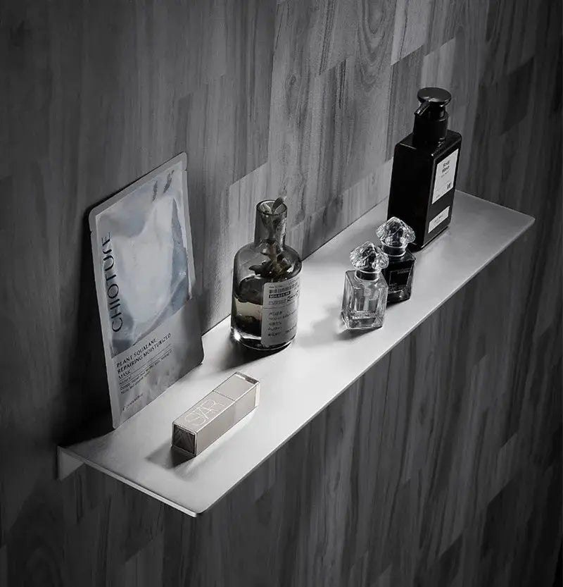 Simples Market 304 stainless steel corner shower shelf, brushed chrome finish for bathroom storage, displayed with bottles