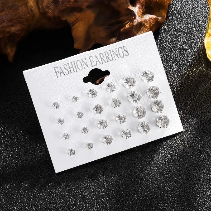 Crystal stud earrings set, 12 pairs of white crystals on a white display card