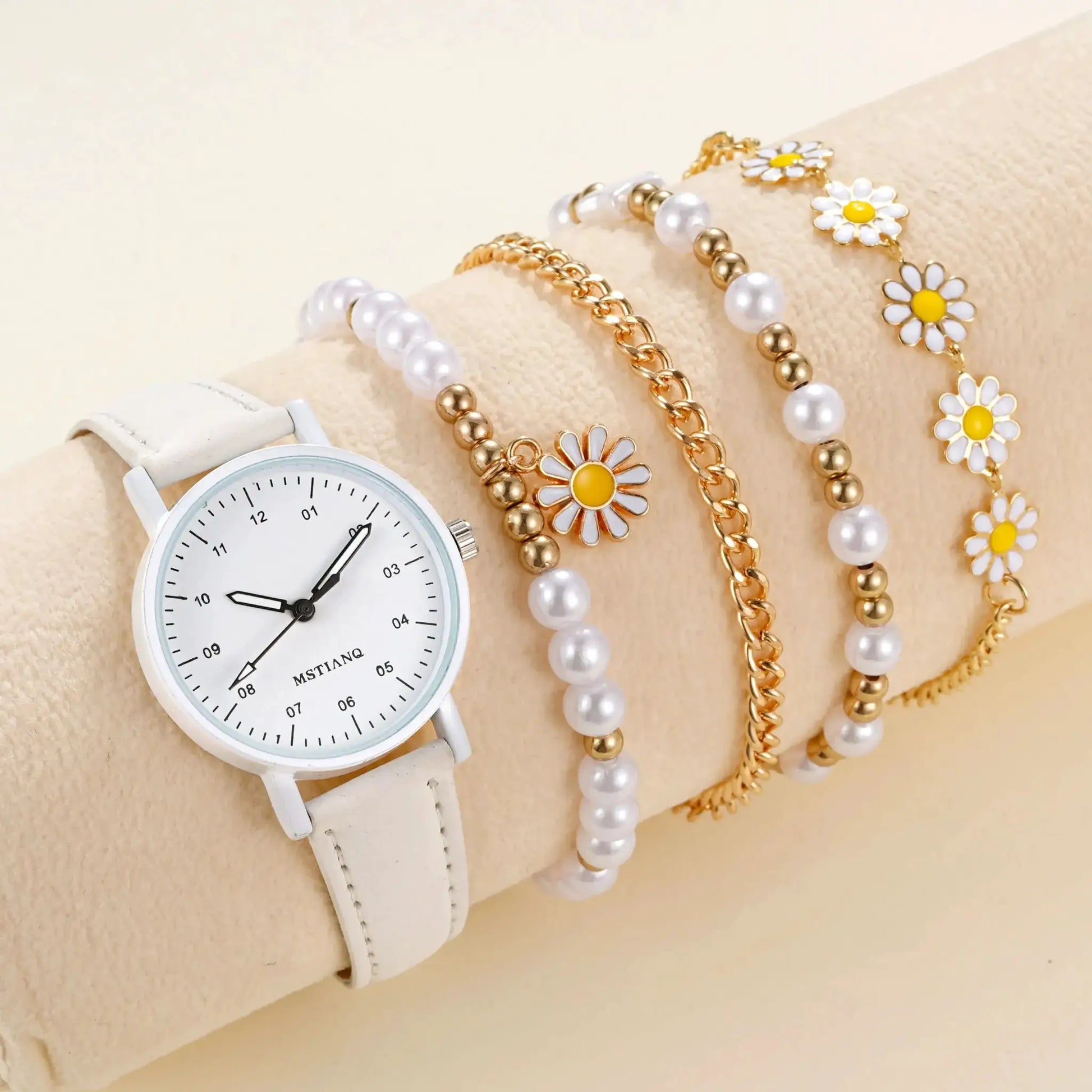 5-piece girls bracelet and watch set Simples Market; white leather watch with pearl beads, gold chains, and daisy charms