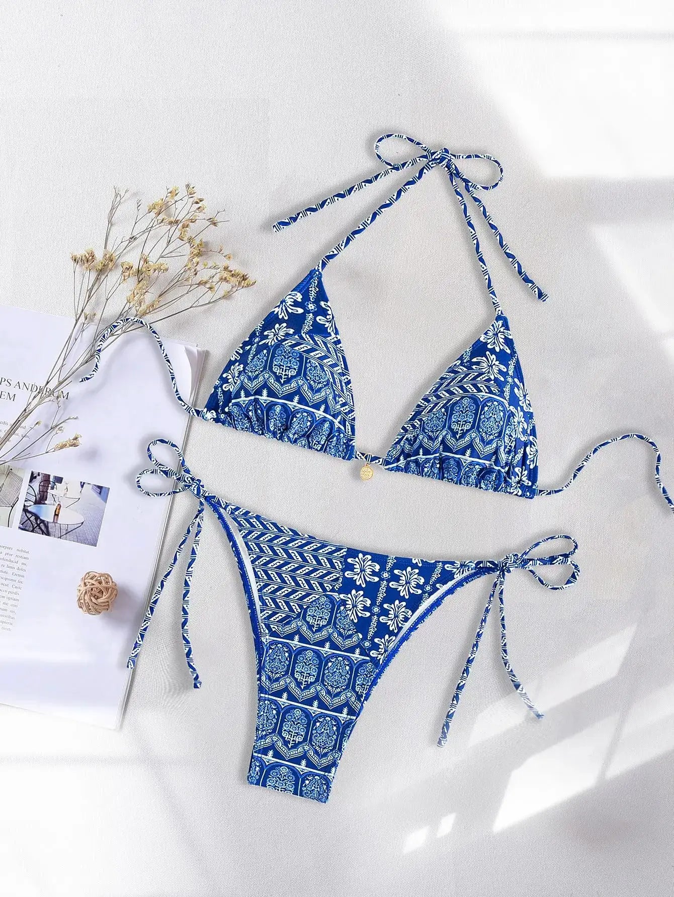 Simples Market 2026 Triangle Bikini Set in blue floral print with push-up triangle top and Brazilian-cut bottoms.