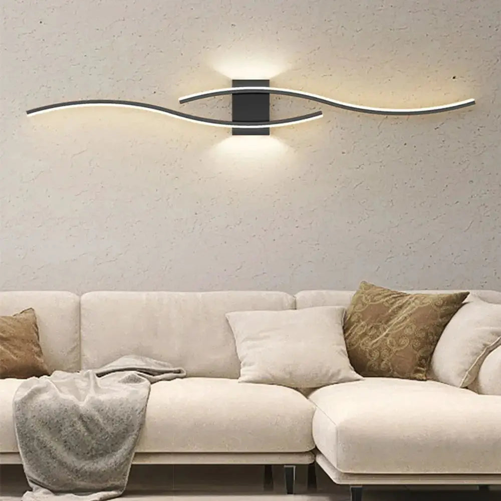 Moder LED Wall Lamp by Simples Market; dual curved white LED strips on a black wall mount.