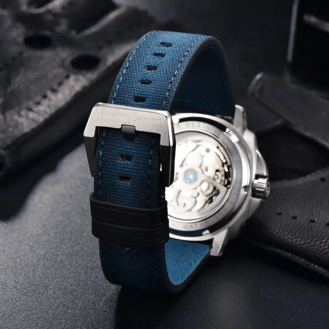 PAGANI DESIGN men's automatic watch with blue fabric strap, stainless steel case, transparent caseback, 200M water resistant