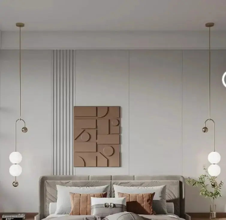 Nordic minimalist chandelier with two brass pendant lights and white glass globes in a neutral living room