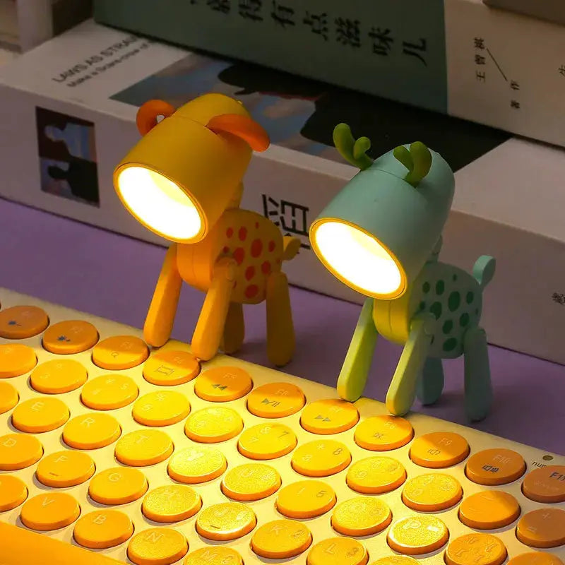 LED mini night lights; two foldable desk lamps shaped as a yellow dog and mint deer with warm glow on a keyboard