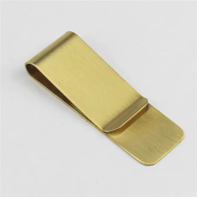 Gold-toned money clip with brushed brass finish by Simples Market.