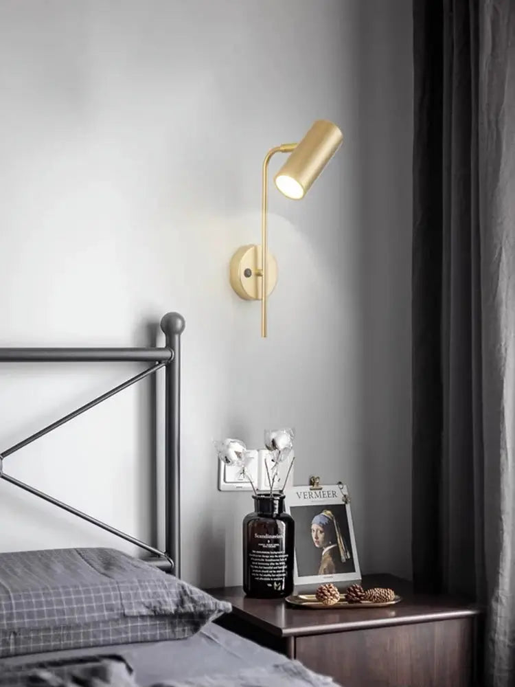 Rotatable hotel bedroom wall lamp with gold iron frame and cylindrical shade for bedside sconce