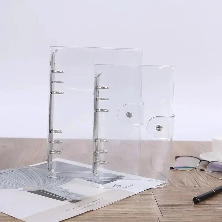 Three transparent PVC 6-ring binder covers (A5/A6/A7) with snap button closures.