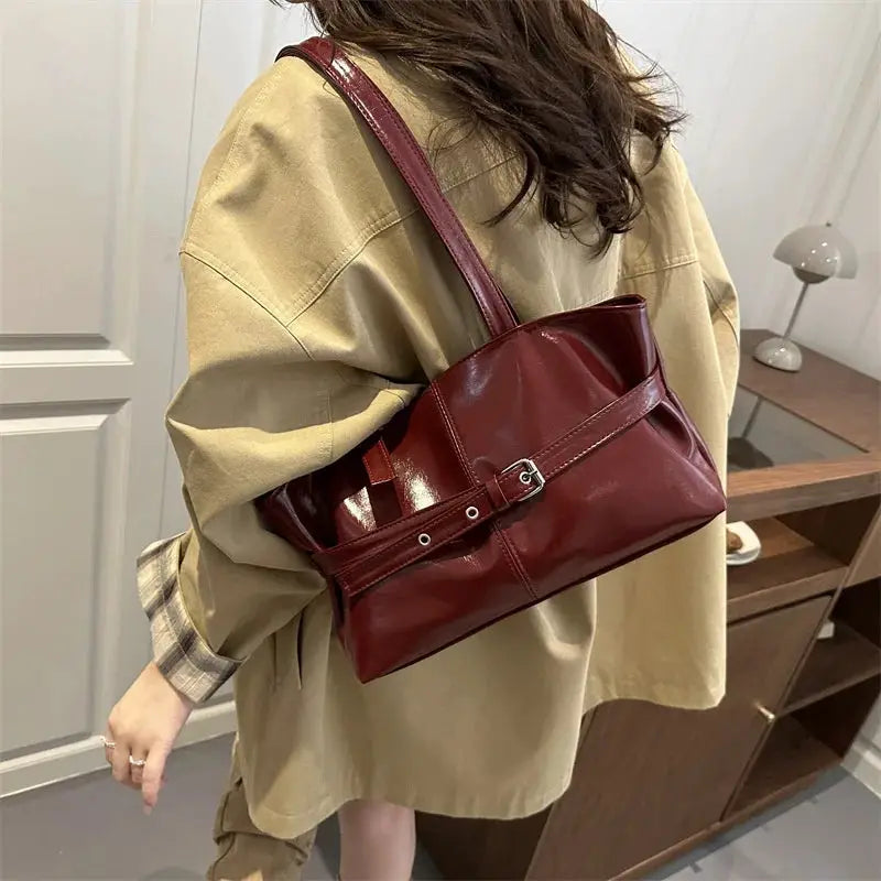 Simples Market burgundy leather handbag with belt-buckle strap, shoulder bag