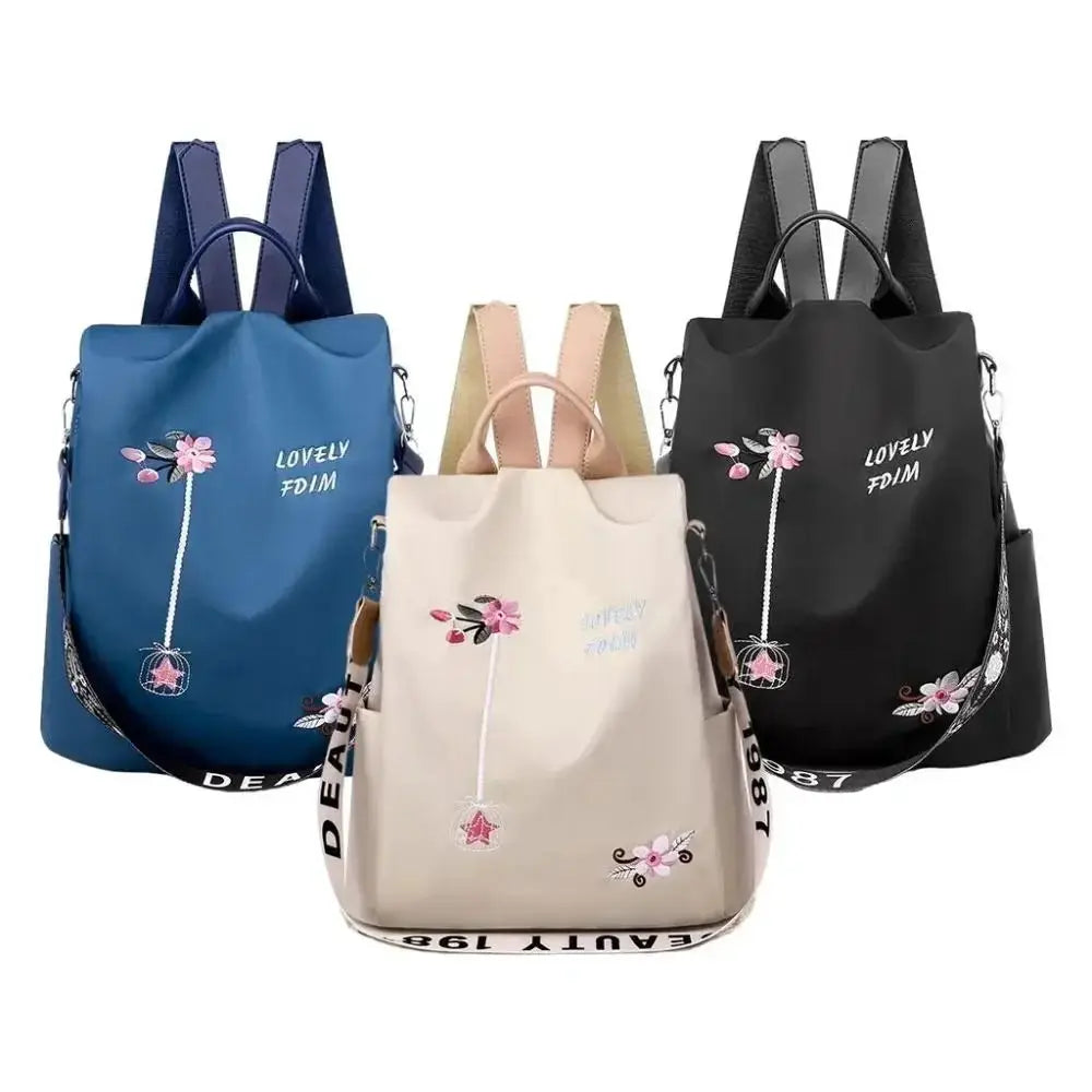 Waterproof Oxford women's backpack with embroidery, available in blue, beige and black.