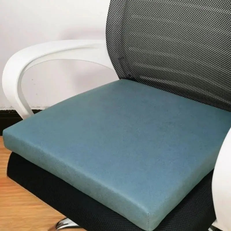 SRETNO natural latex chair cushion in blue-teal on a black mesh office chair